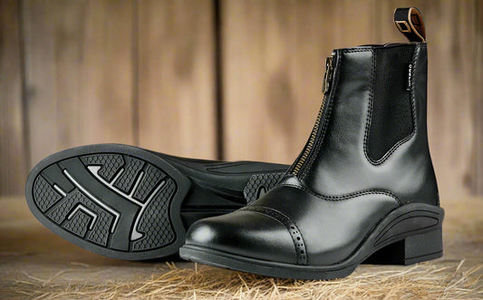 A black paddock boot with a lace-up front and a durable rubber outsole, designed for equestrian activities.