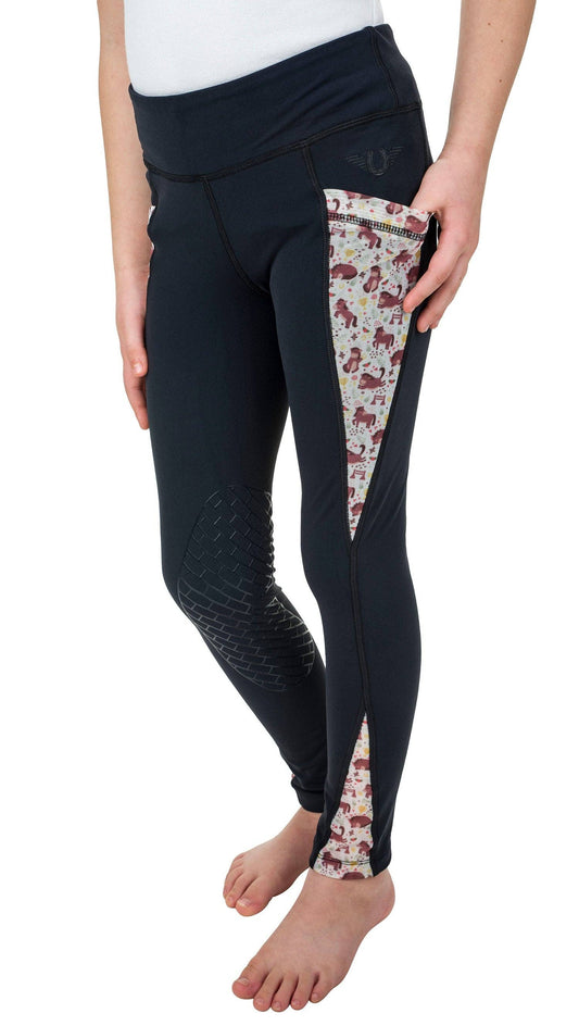 Black leggings with floral patterned side panels worn by a person on a white background