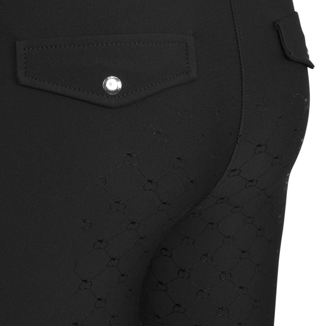 Close-up of a black textured fabric with a button on a white background